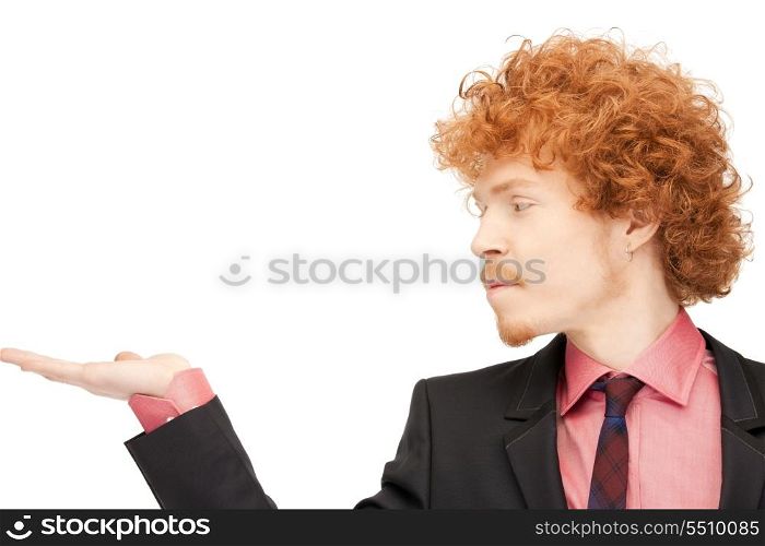 handsome man showing something on the palm of his hand