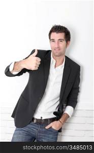 Handsome man showing thumb up