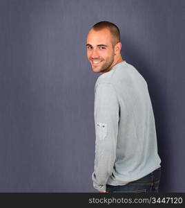 Handsome man standing on blue background