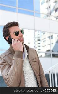 Handsome man using a phone