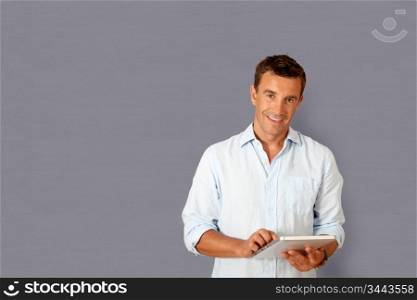 Handsome man using electronic tablet