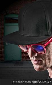Handsome man wearing a stylish cotton baseball cap and sunglasses