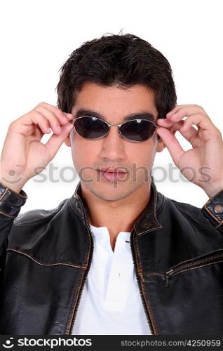 handsome man wearing leather jacket and sunglasses
