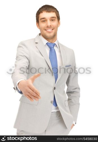 handsome man with an open hand ready for handshake