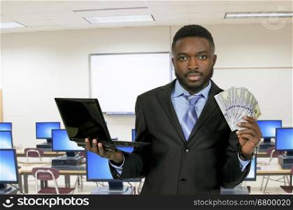 Handsome man with cash using a computer