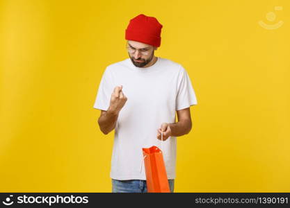 Handsome man with shopping bag feeling worry and serious. Handsome man with shopping bag feeling worry and serious.