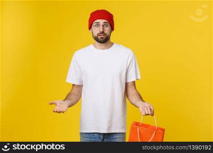 Handsome man with shopping bag feeling worry and serious. Handsome man with shopping bag feeling worry and serious.