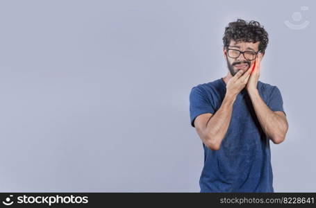 Handsome man with toothache isolated, Person with pulpitis or toothache problem, Concept of people rubbing cheek with toothache