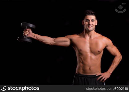 Handsome man working out isolated over a copy space background