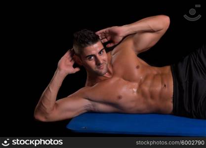 Handsome man working out isolated over a copy space background