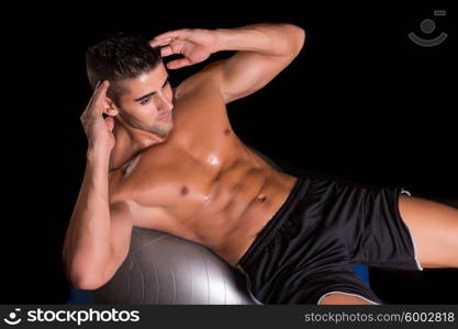 Handsome man working out isolated over a copy space background