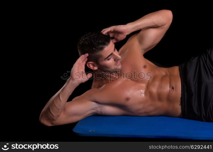 Handsome man working out isolated over a copy space background