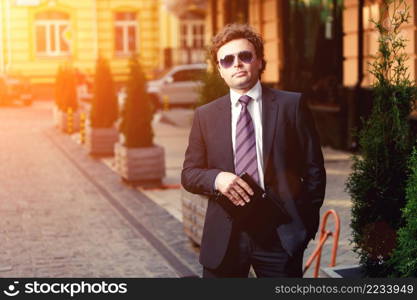 Handsome mature caucasian businessman outdoor wearing suit. Handsome mature businessman outdoor