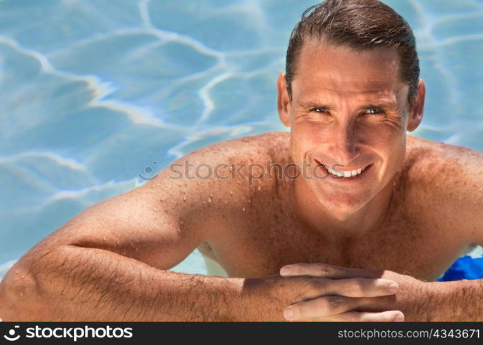 Handsome Middle Aged Man Relaxing In Swimming Pool