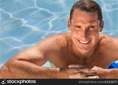 Handsome Middle Aged Man Relaxing In Swimming Pool