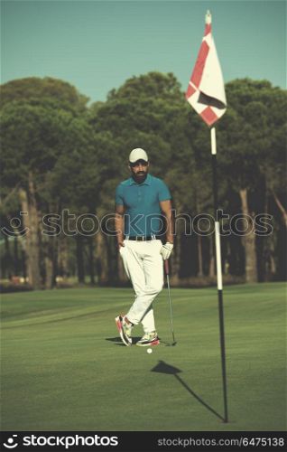 handsome middle eastern golf player portrait at course at sunny day. golf player portrait at course