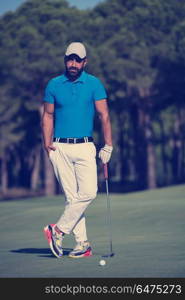 handsome middle eastern golf player portrait at course at sunny day. golf player portrait at course