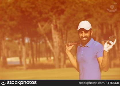 handsome middle eastern golf player portrait at course at sunny day. golf player portrait at course