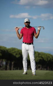 handsome middle eastern golf player portrait at course at sunny day wearing red shirt