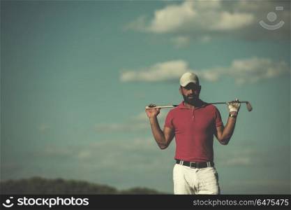 handsome middle eastern golf player portrait at course at sunny day wearing red shirt. handsome middle eastern golf player portrait at course