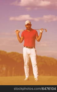 handsome middle eastern golf player portrait at course at sunny day wearing red shirt. handsome middle eastern golf player portrait at course