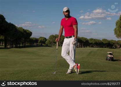 handsome middle eastern golf player portrait at course on beautiful sunset in background