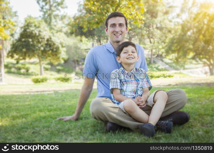 Handsome Mixed Race Father and Young Son Portrait in the Park.