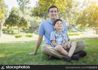 Handsome Mixed Race Father and Young Son Portrait in the Park.