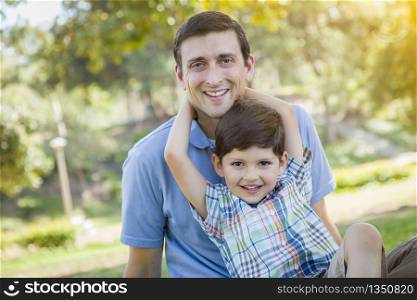 Handsome Mixed Race Father and Young Son Portrait in the Park.