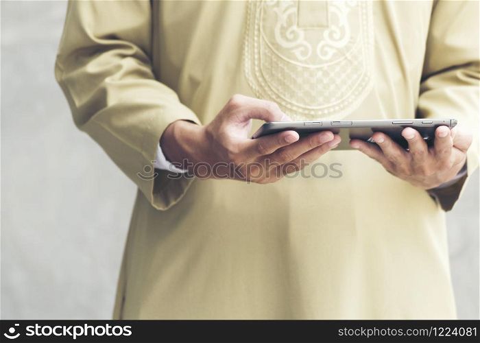 Handsome modern arab man showing credit card