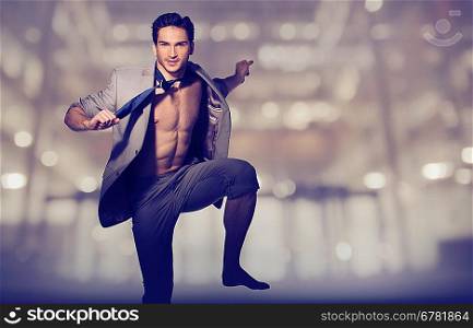 Handsome muscular guy in loose suit
