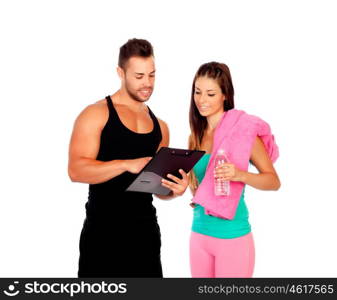 Handsome personal trainer with a attractive girl isolated on a white background