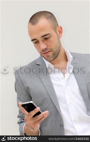 Handsome salesman talking on mobile phone