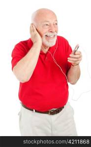 Handsome senior man having fun listening to music on a portable mp3 player. Isolated on white.