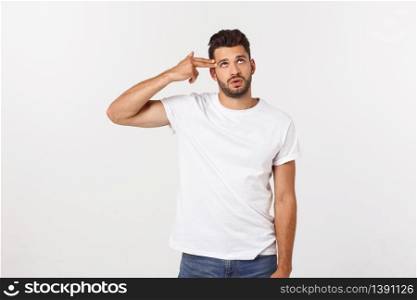 Handsome smiling businessman showing ok sign with fingers over gray background. Handsome smiling businessman showing ok sign with fingers over gray background.