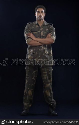 Handsome soldier with arms folded