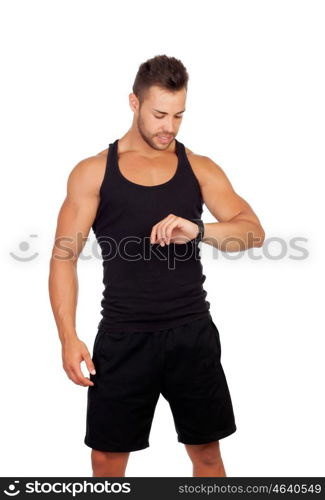 Handsome sportsman looking at his watch isolated on white background