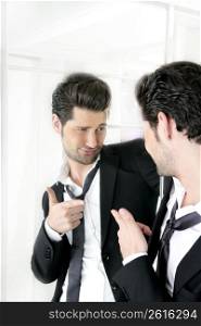 Handsome suit proud young man humor funny gesturing in a mirror
