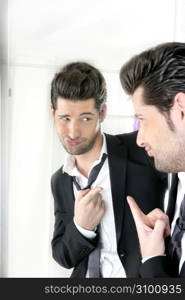 Handsome suit proud young man humor funny gesturing in a mirror