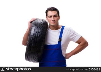 Handsome tyre repairman isolated on white