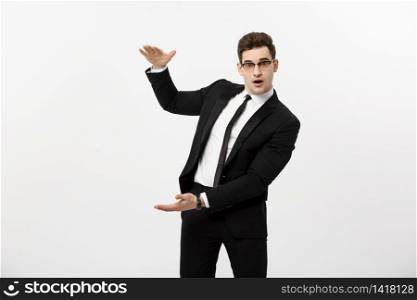 Handsome young business man happy smile, businessman showing something on the open palm, concept of advertisement product isolated over white background. Business Concept - Handsome young business man happy smile, businessman showing something on the open palm, concept of advertisement product isolated over white background