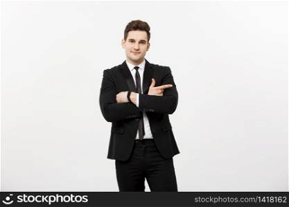 Handsome young business man happy smile point finger to empty copy space, businessman showing pointing side, concept of advertisement product, isolated over white background.. Handsome young business man happy smile point finger to empty copy space, businessman showing pointing side, concept of advertisement product, isolated over white background