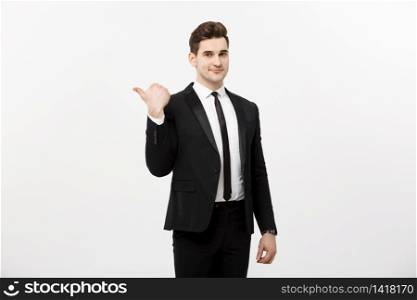 Handsome young business man happy smile point finger to empty copy space, businessman showing pointing side, concept of advertisement product, isolated over white background. Handsome young business man happy smile point finger to empty copy space, businessman showing pointing side, concept of advertisement product, isolated over white background.