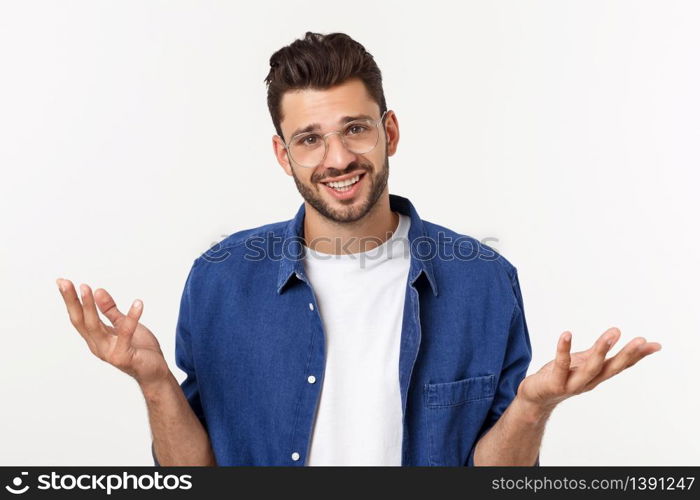 Handsome young businessman in classic suit smiling, looking at camera keeping palm up on white background. Business man with empty hand. Handsome young businessman in classic suit smiling, looking at camera keeping palm up on white background. Business man with empty hand.