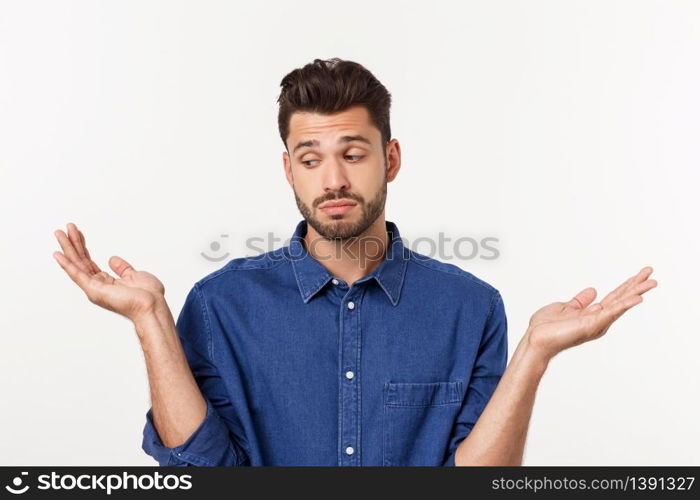 Handsome young businessman in classic suit smiling, looking at camera keeping palm up on white background. Business man with empty hand. Handsome young businessman in classic suit smiling, looking at camera keeping palm up on white background. Business man with empty hand.