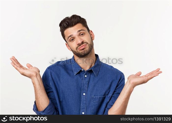 Handsome young businessman in classic suit smiling, looking at camera keeping palm up on white background. Business man with empty hand. Handsome young businessman in classic suit smiling, looking at camera keeping palm up on white background. Business man with empty hand.