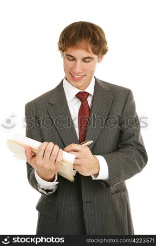 Handsome young businessman reviewing a good report. Isolated on white.