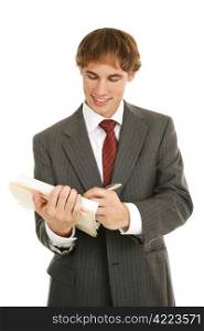 Handsome young businessman reviewing a good report. Isolated on white.