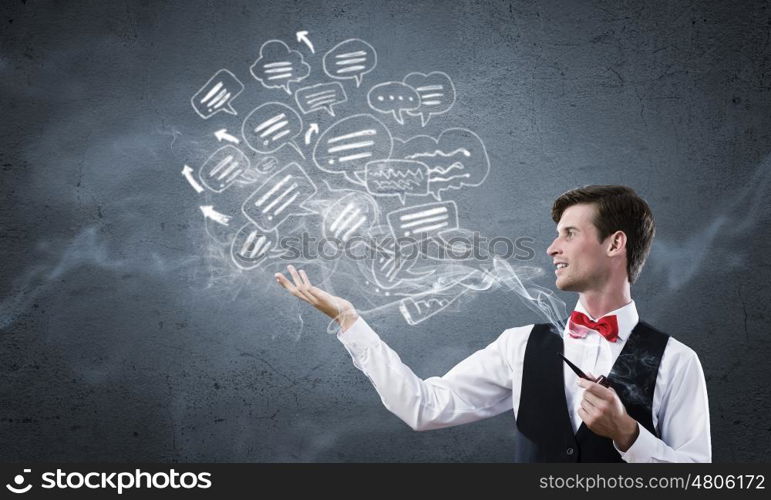 Handsome young businessman thinking over ideas and smoking pipe. Businessman and pipe smoke