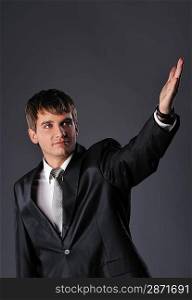 Handsome young businessman with outstretched hand